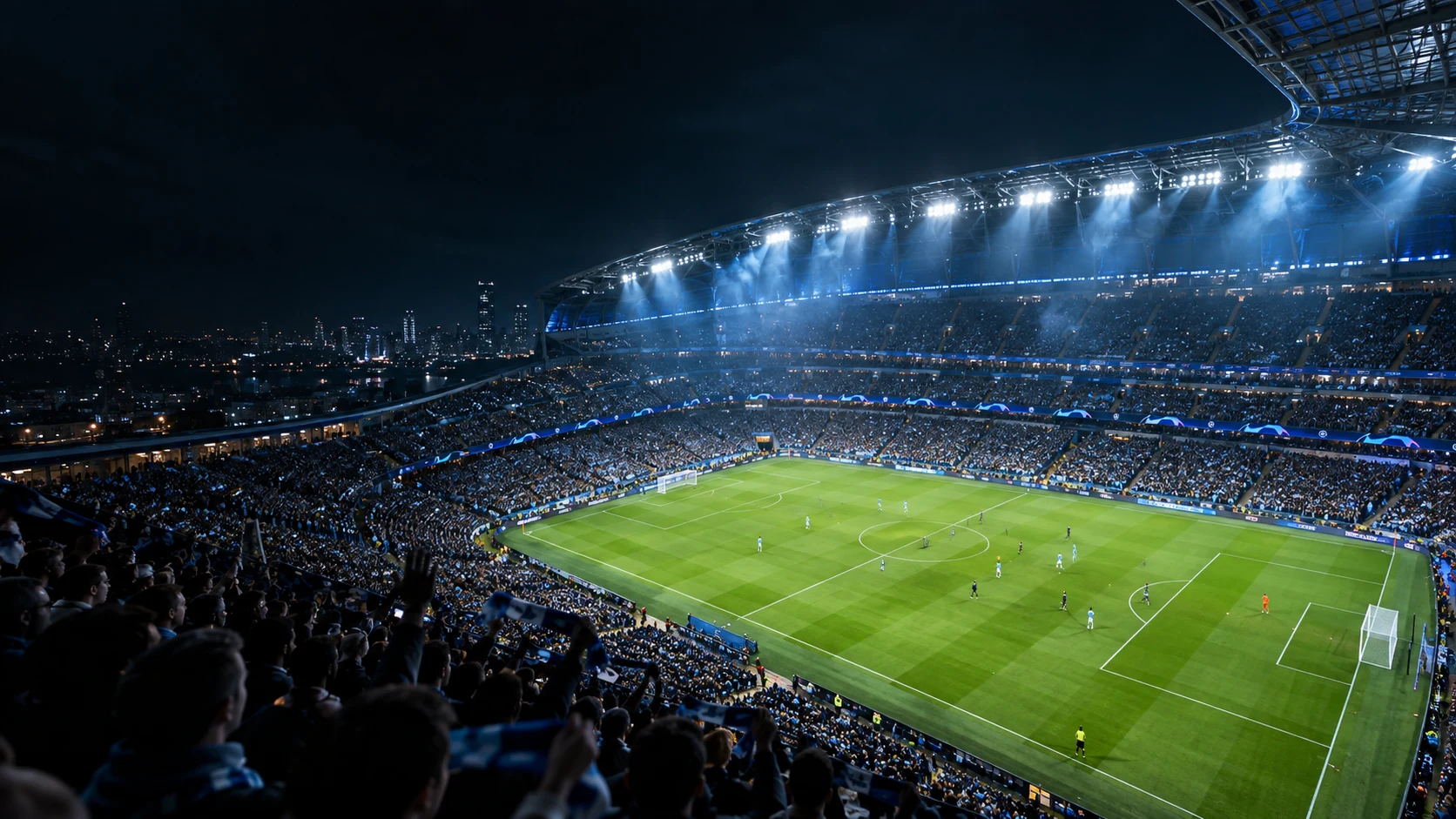 En upplyst fotbollsarena med publik på läktarna
